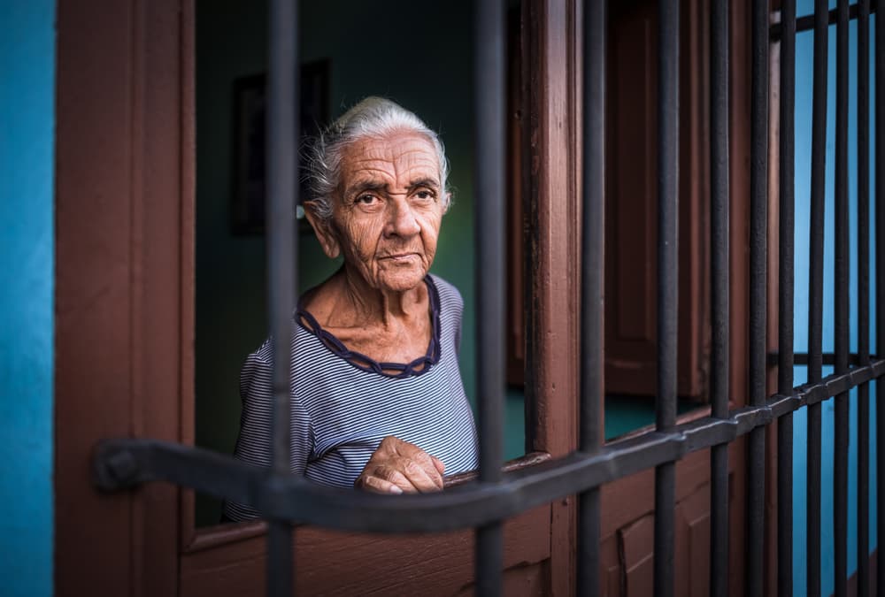 Elder Woman Looking Out by Marco Tagliarino — canvas wall art