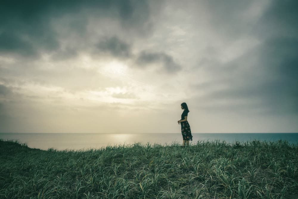 Woman Overlooking Ocean by Nobu Ishijima — canvas wall art