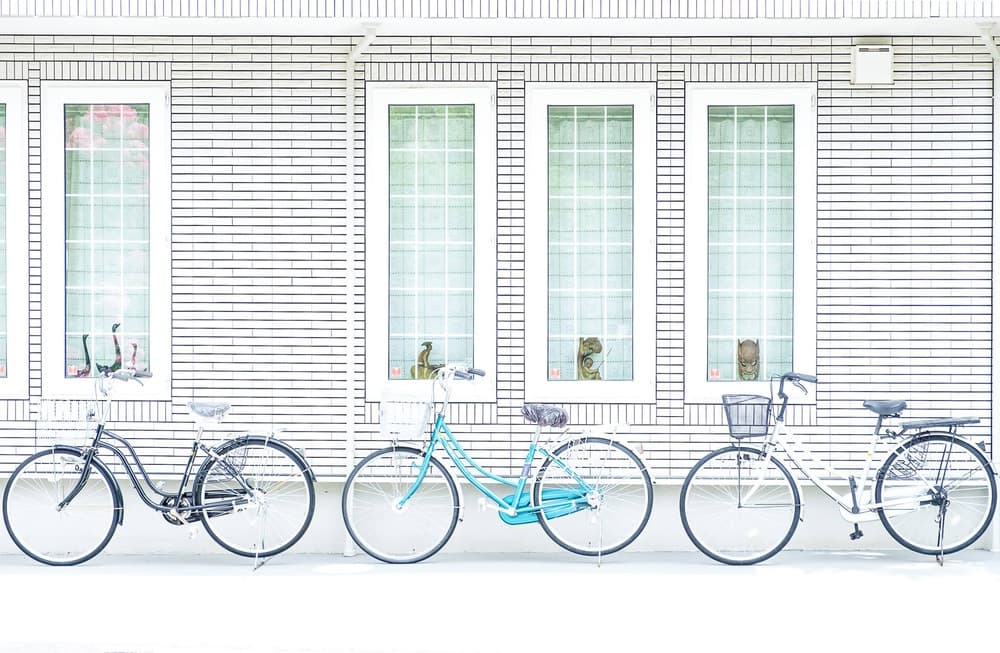 Bicycles by White Windows by Tomoshi Hara — canvas wall art