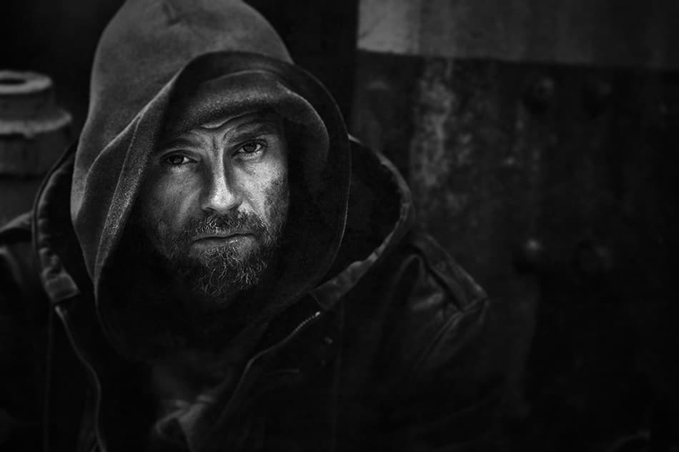Intense Hooded Man Portrait by Mohammed Baqer — canvas wall art
