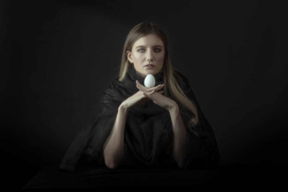 Enigmatic Woman and Egg by Hooman Sedaghi — canvas wall art