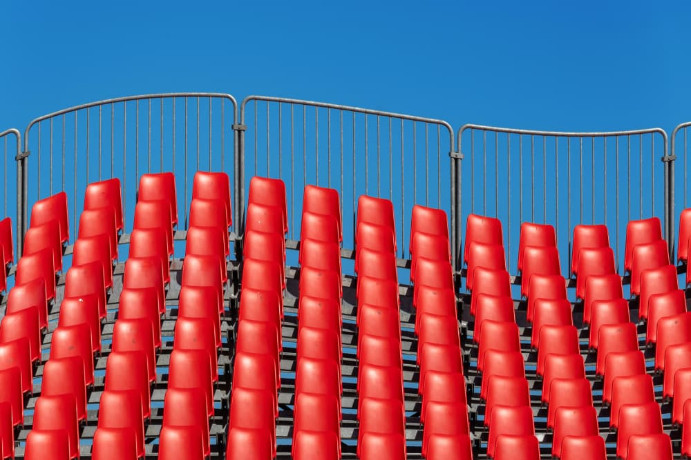 Vibrant Red Seats by Andrea Comari — canvas wall art