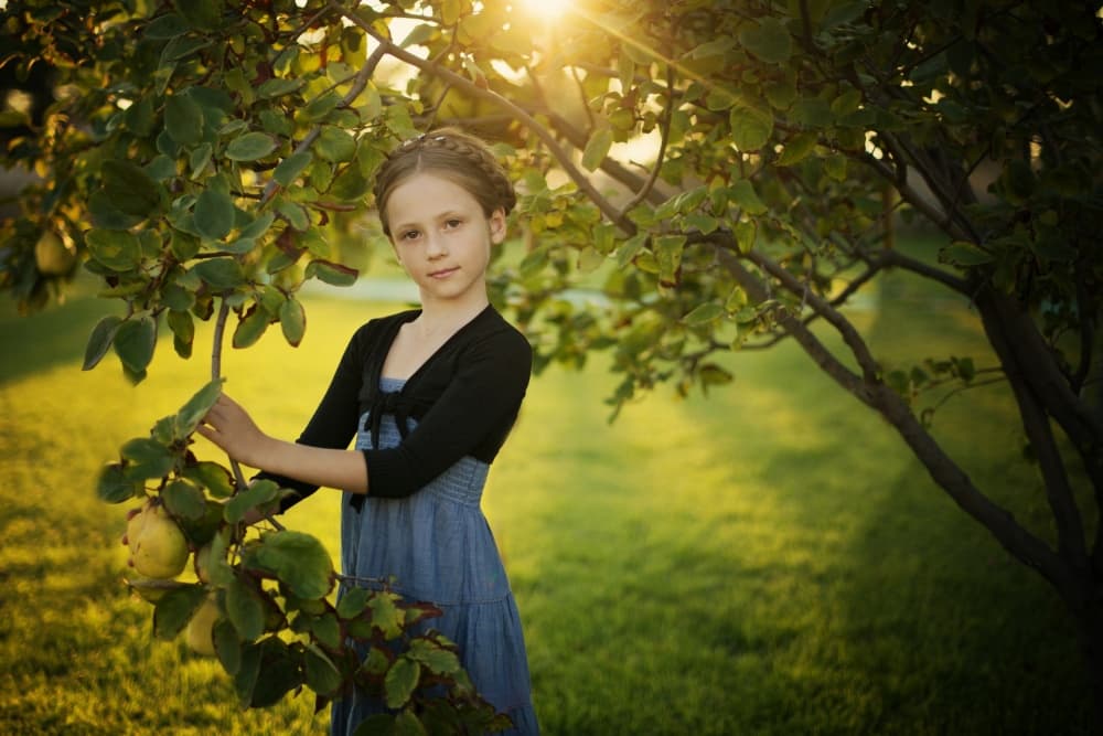Girl By Quince Tree by Elena Karagyozova — canvas wall art