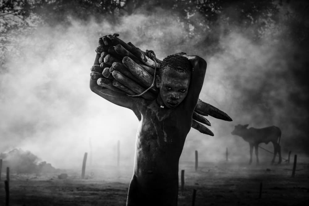 Young Boy Carrying Firewood by Svetlin Yosifov — canvas wall art