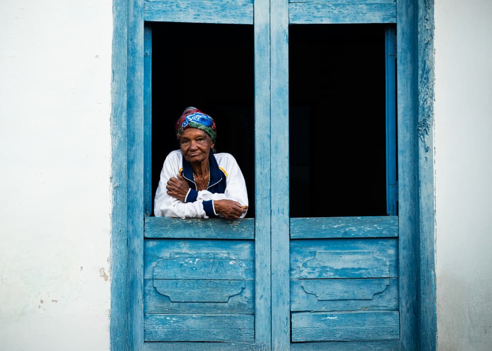 Elderly Woman in Blue Window by Chao Feng 天馬 — canvas wall art
