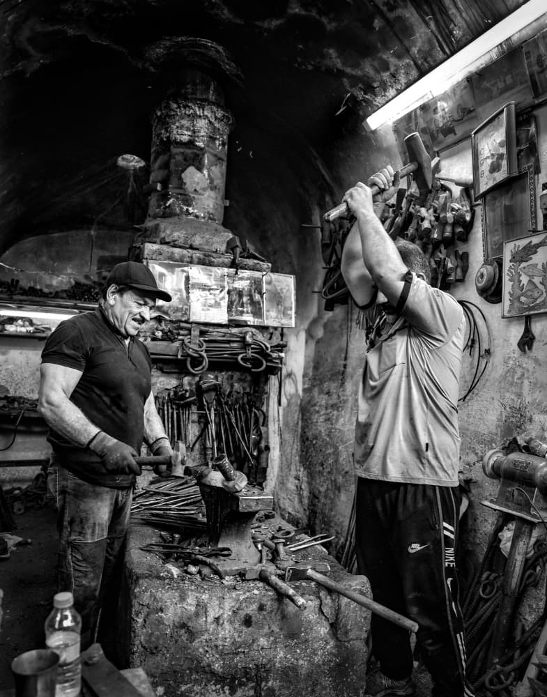 Blacksmiths at Work by Bashar Alsofey — canvas wall art