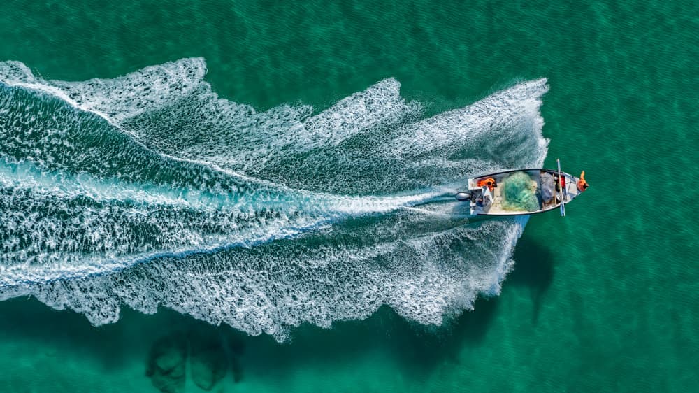 Boat on Turquoise Water by Ido Meirovich — canvas wall art