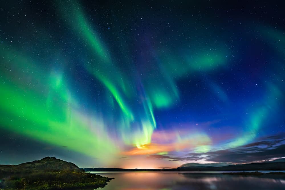 Vibrant Northern Lights Reflection by Jeffrey C. Sink — canvas wall art
