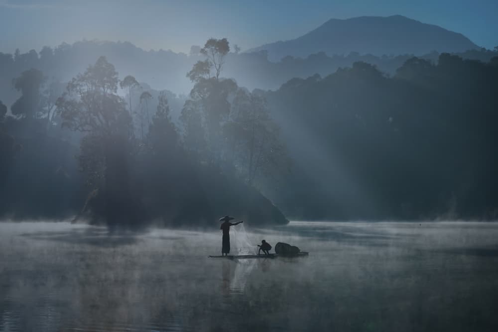 Misty Morning Fisherman by Yohan Tan — canvas wall art