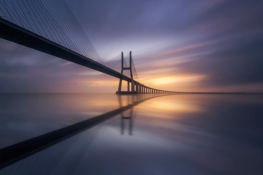 Long Bridge Sunset Reflection by Jorge Ruiz Dueso — canvas wall art