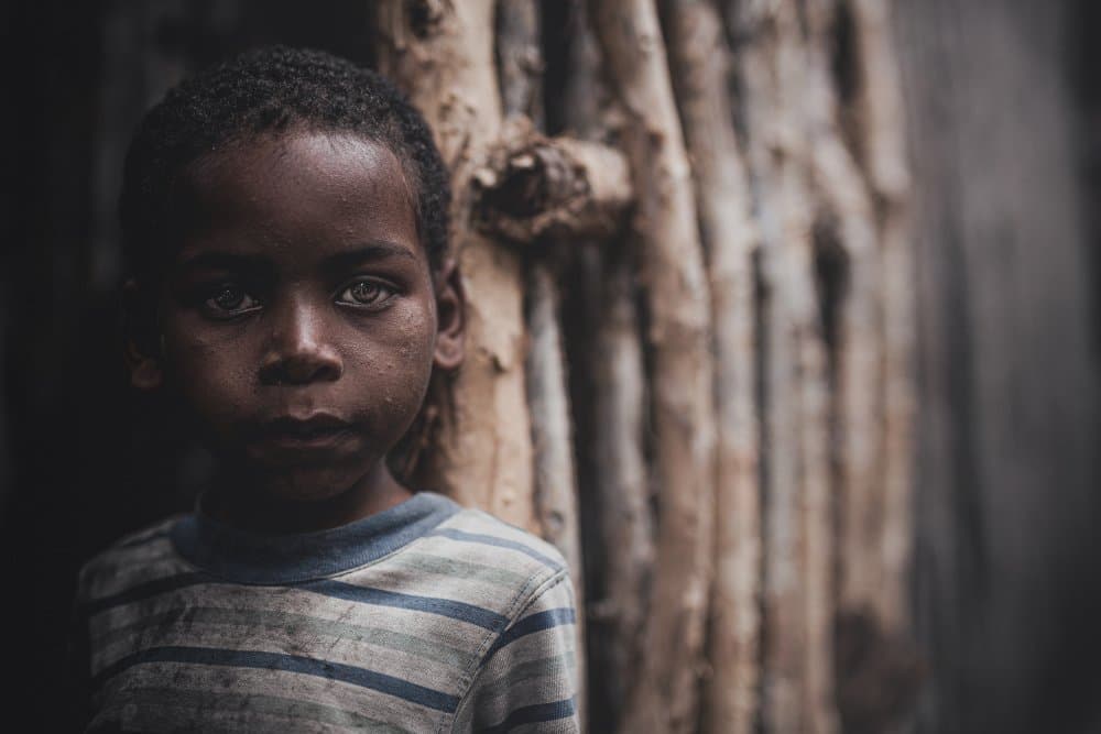 Pensive African Boy by Marco Tagliarino — canvas wall art