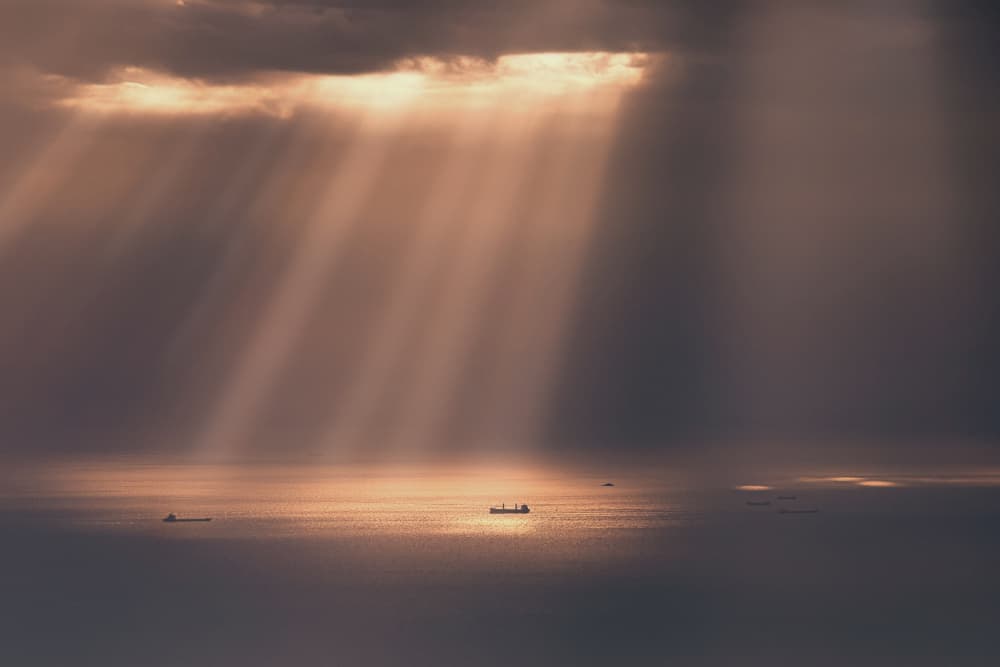 Golden Sun Rays Over Ocean by Collin ZENG — canvas wall art