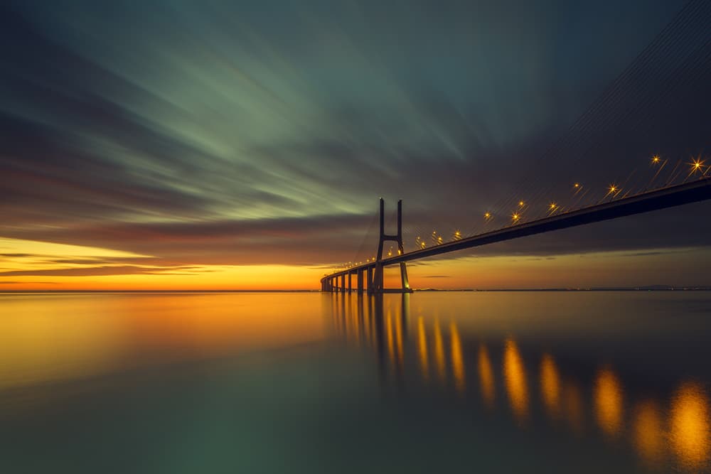 Serene Sunset Bridge by Thomas Siegel — canvas wall art