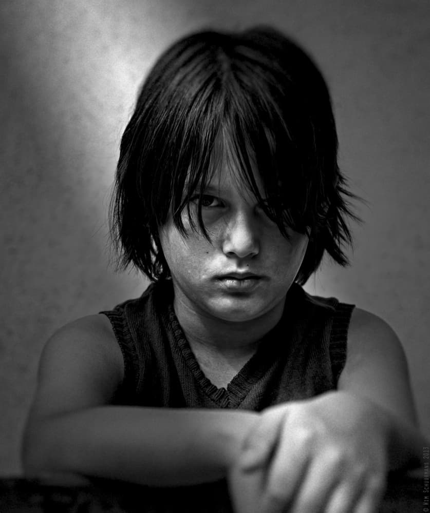 Intense Boy Portrait by Wim Schuurmans — canvas wall art