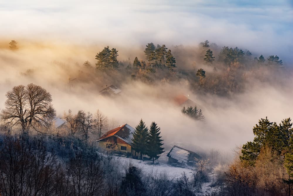 Misty Winter Village by Bez Dan — canvas wall art