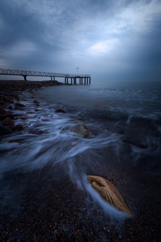 Moody Coastal Pier by Gustavo Ribes — canvas wall art