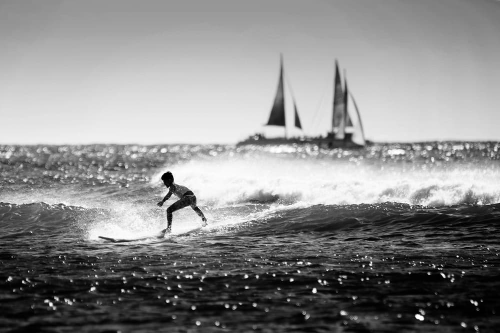 Young Surfer and Sailboats by Shin Woo Ryu — canvas wall art
