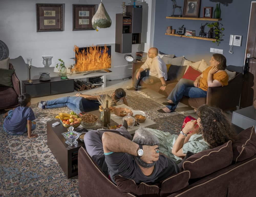 Family Watching TV Fire by Mitra Bahmani — canvas wall art