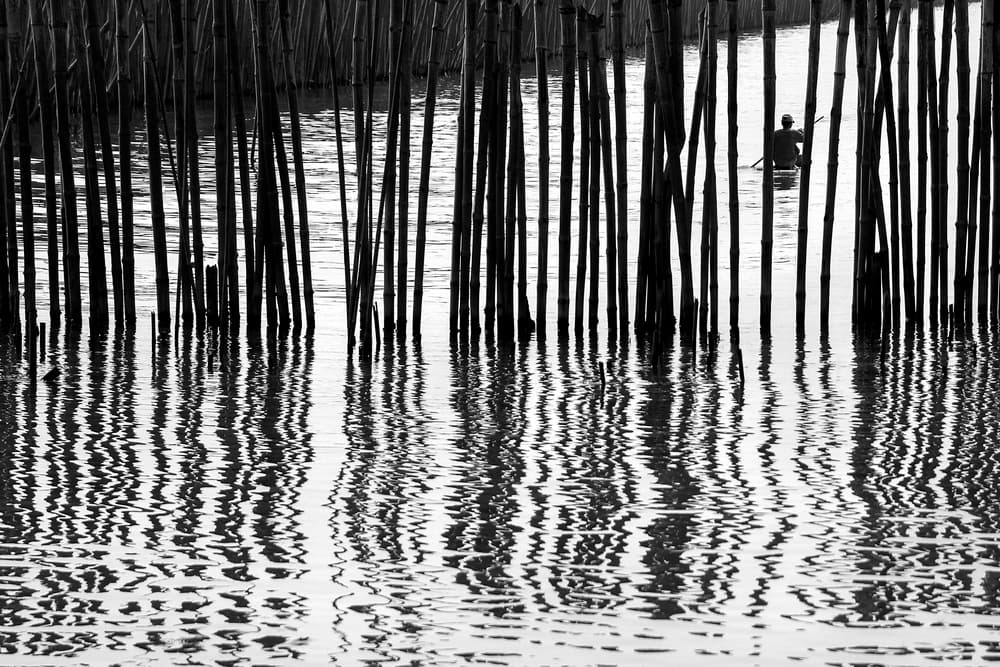 Solitary Boat Reflections by Ekkachai Khemkum — canvas wall art