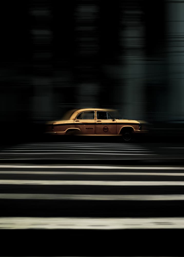 Speeding Yellow Taxi by Susnata Majumder — canvas wall art