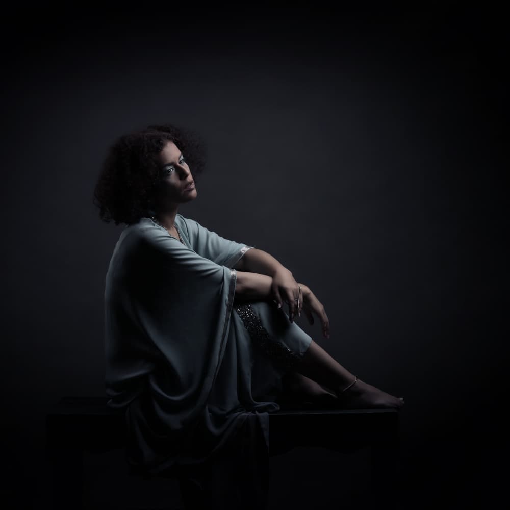 Pensive Woman in Blue by Moein Hasheminasab — canvas wall art