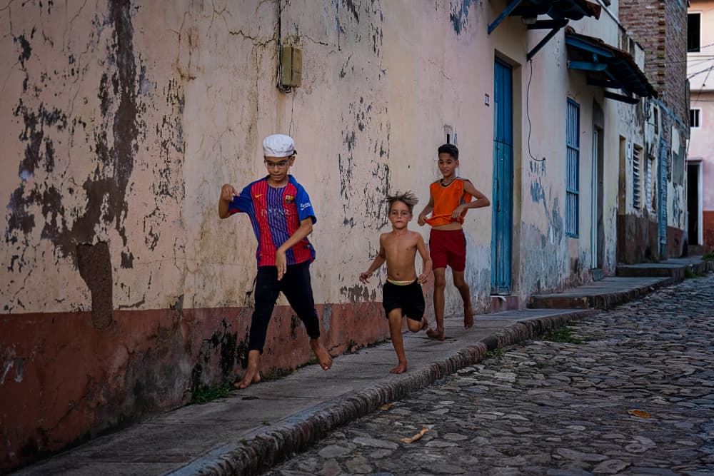 Kids Barefoot Street Run by Hanping Xiao — canvas wall art