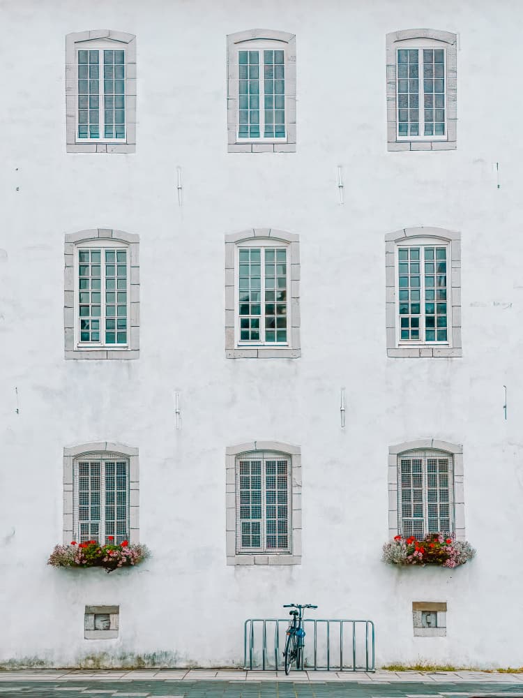 White Facade With Flowers by Cindy Liu — canvas wall art