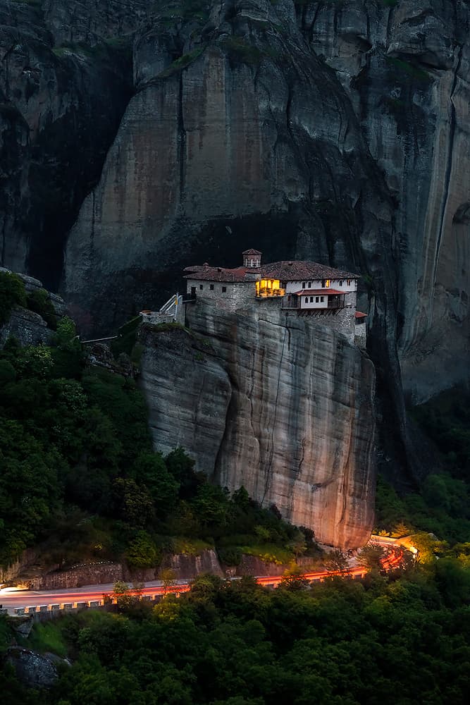 Meteora Cliffside Lights by Ilias Nikoloulis — canvas wall art