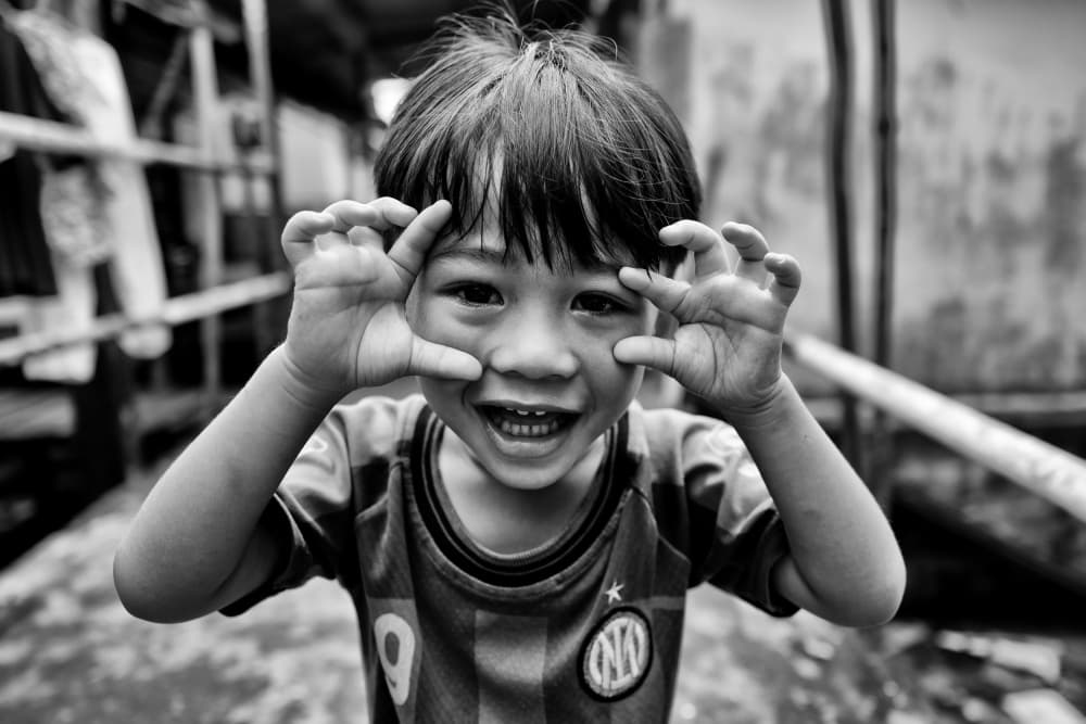 Playful Boy Smiling by Kieron Long — canvas wall art