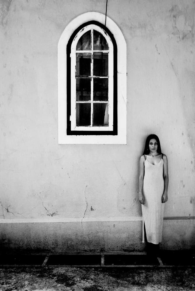 Woman By Arched Window by Milena Seita — canvas wall art