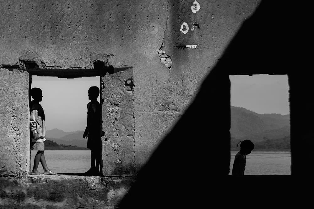 Children by Ruined Doorway by Ekkachai Khemkum — canvas wall art