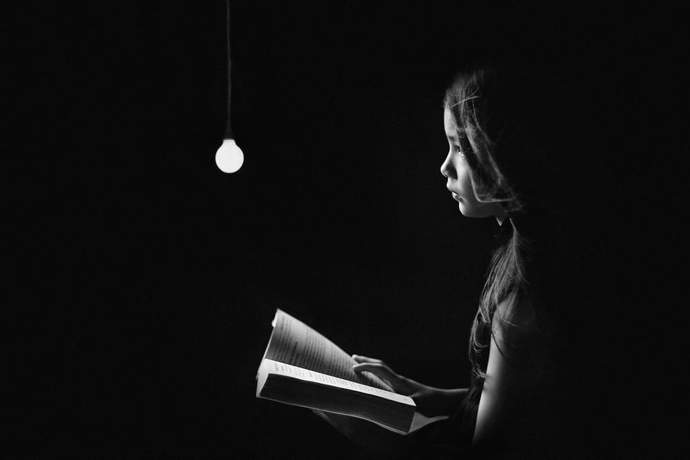 Girl Reading By Light by Teguh Yudhi Winarno — canvas wall art