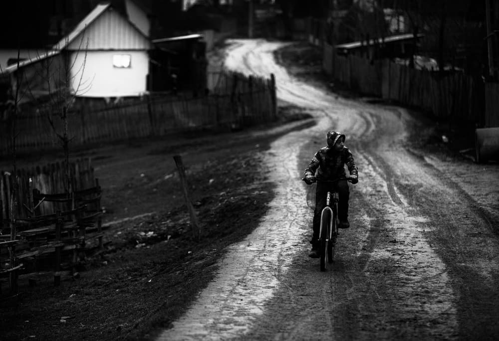 Solitary Rider Village Road by Julien Oncete — canvas wall art