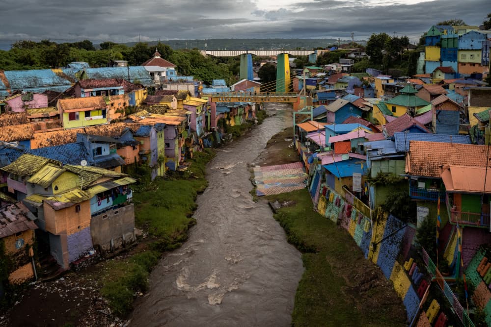 Colorful Riverside Village by Alin Federiga — canvas wall art