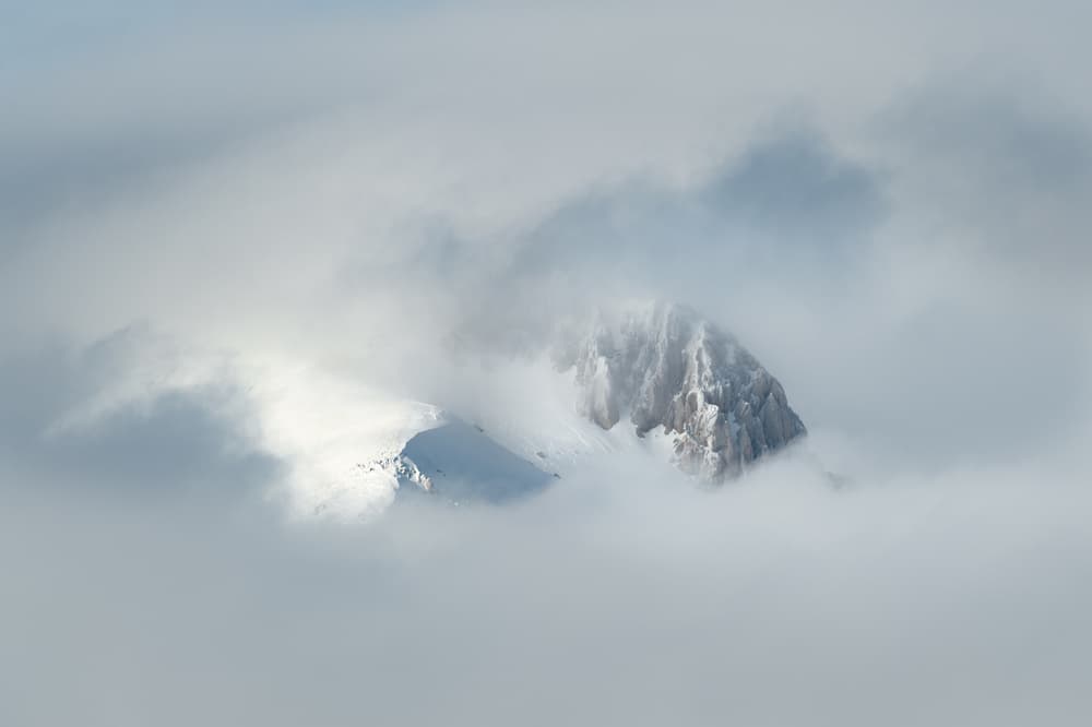 Snowy Peaks In Clouds by Riccardo Lucidi — canvas wall art