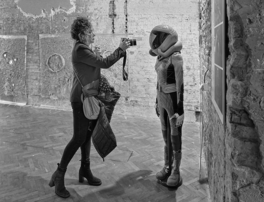 Woman Photographs Space Suit by Miodrag Kosanovic — canvas wall art