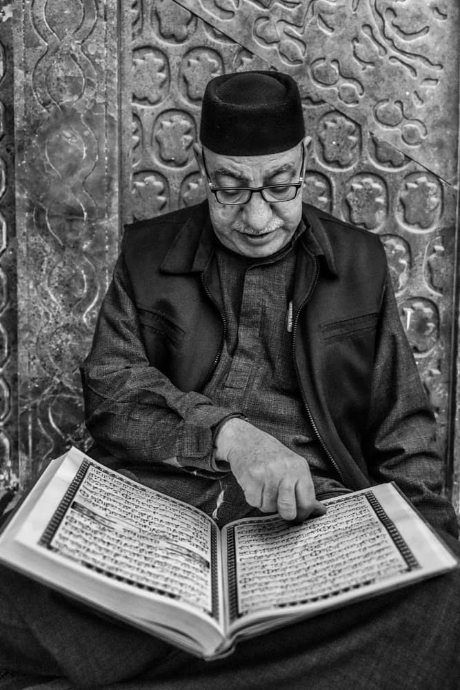 Muslim Man Reading Scripture by Bashar Alsofey — canvas wall art