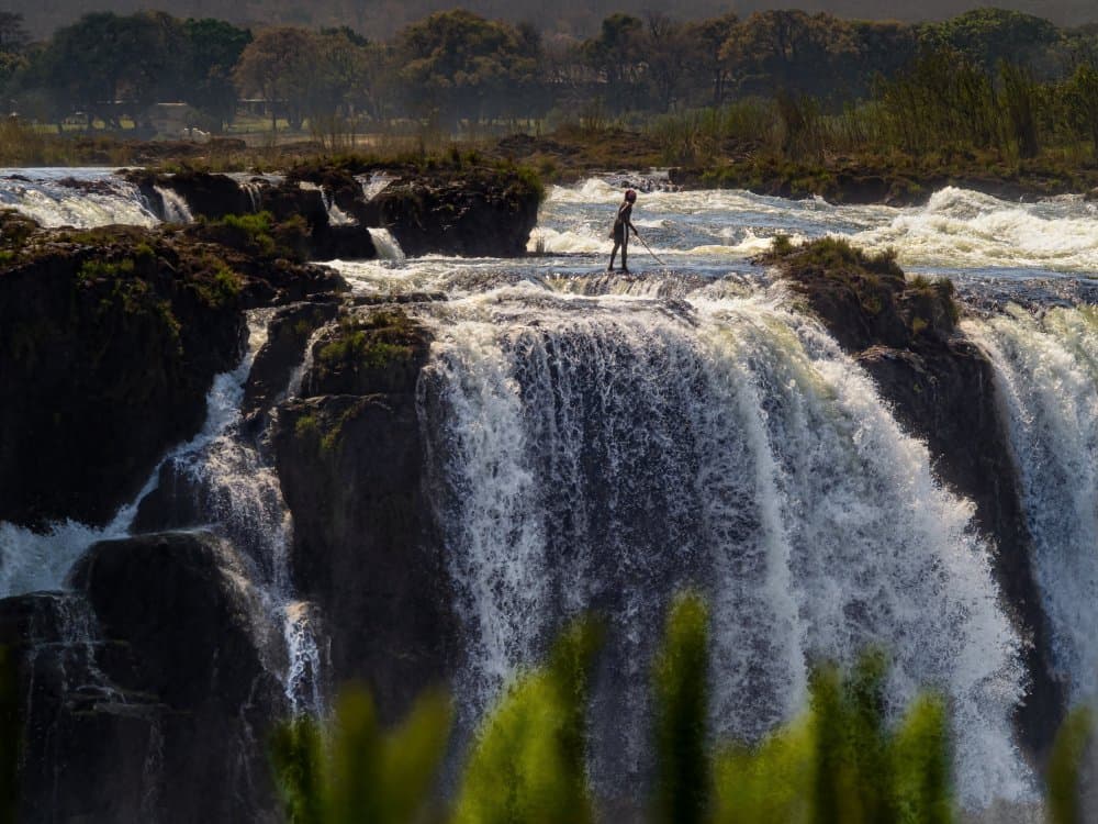 Lone Figure Waterfall by Ilona Rosenkrancová — canvas wall art
