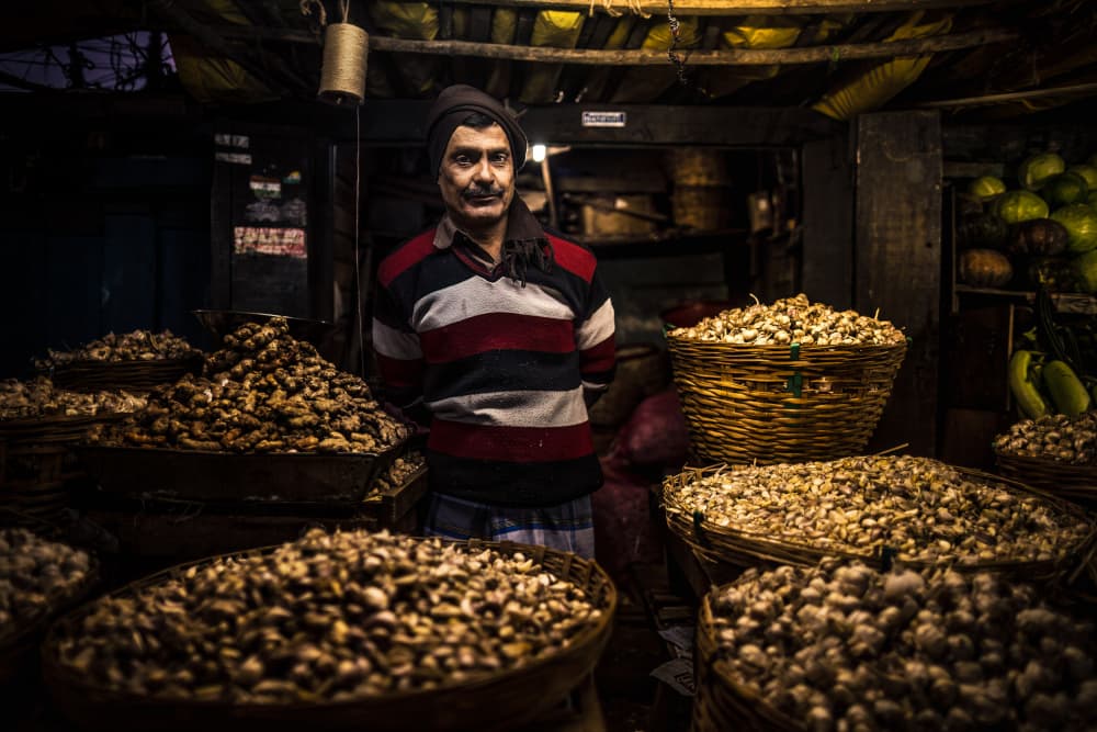 Market Vendor's Gaze by Marco Tagliarino — canvas wall art