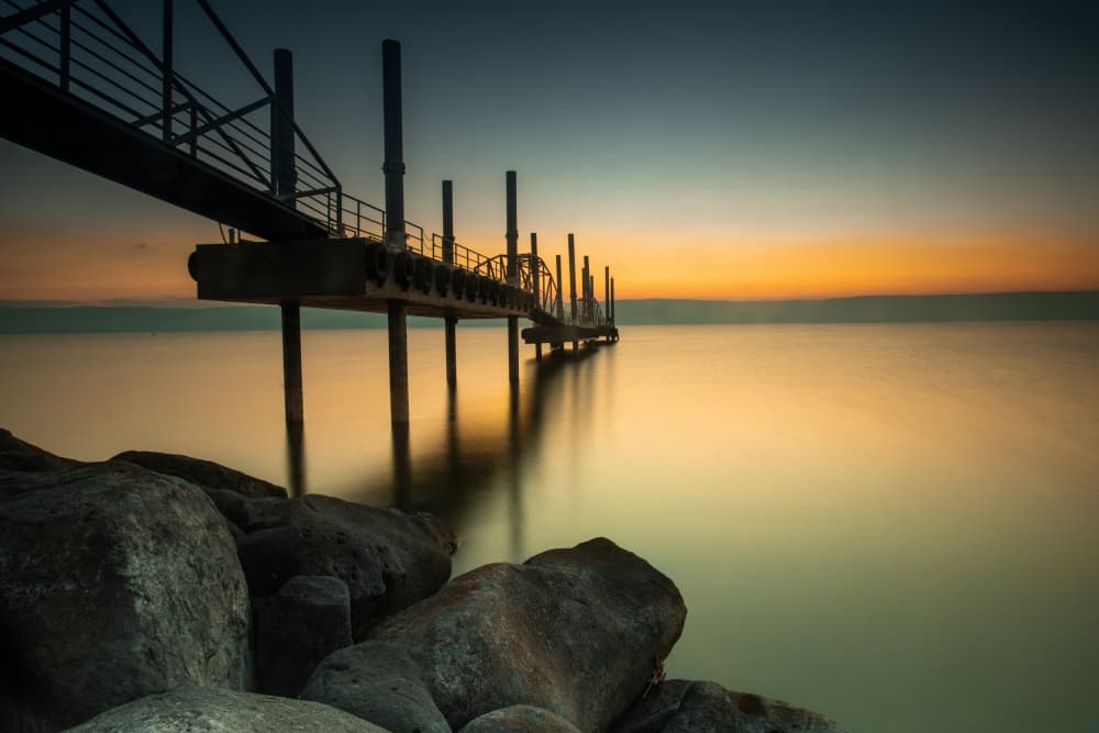 Tranquil Pier Sunset by Wisam Hassan — canvas wall art