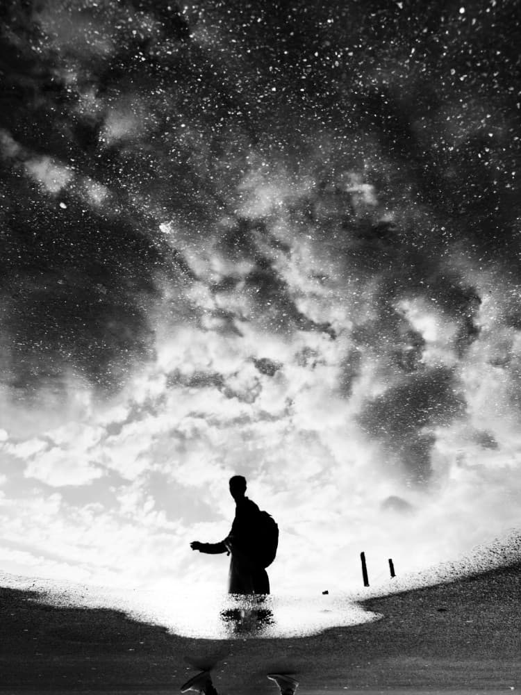 Man Under Starry Clouds by Adam Dauria ☂ — canvas wall art