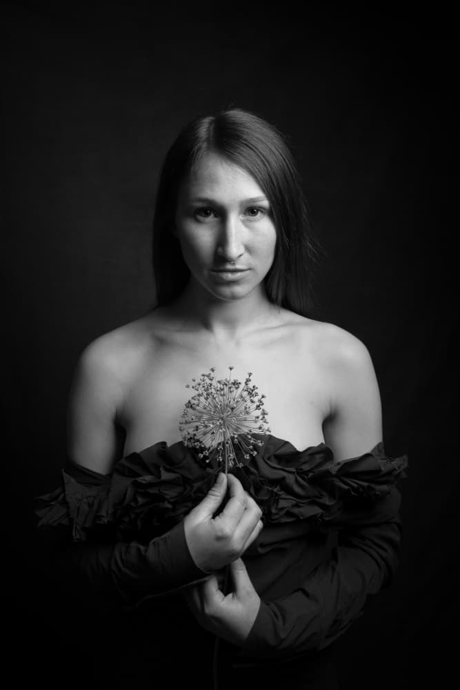 Pensive Woman Holding Flower by Ruth Franke — canvas wall art
