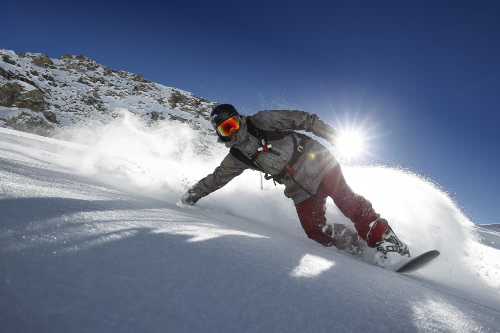 Sunny Snowboard Action by Jakob Sanne — canvas wall art