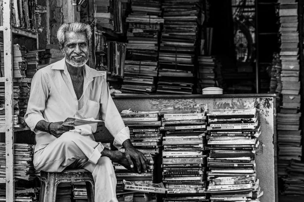 Indian Bookseller's Smile by Marco Tagliarino — canvas wall art