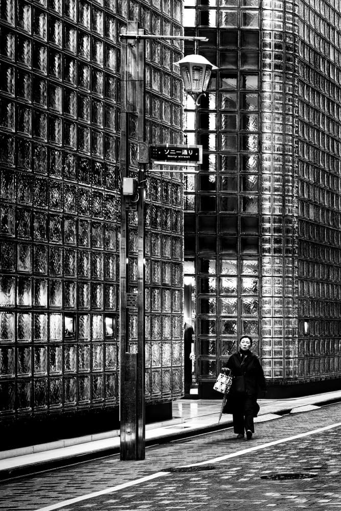 Solitary City Walker by Michel Guyot — canvas wall art
