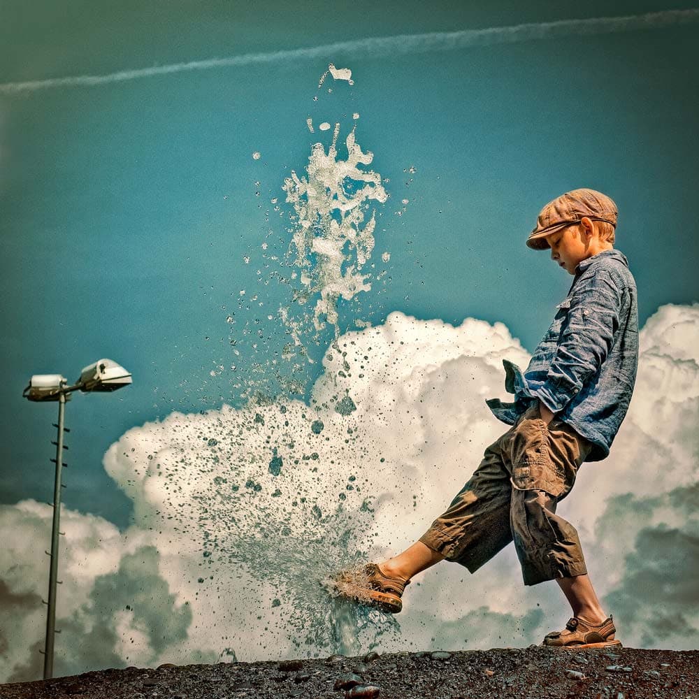 Boy Splashing Water by ambra — canvas wall art