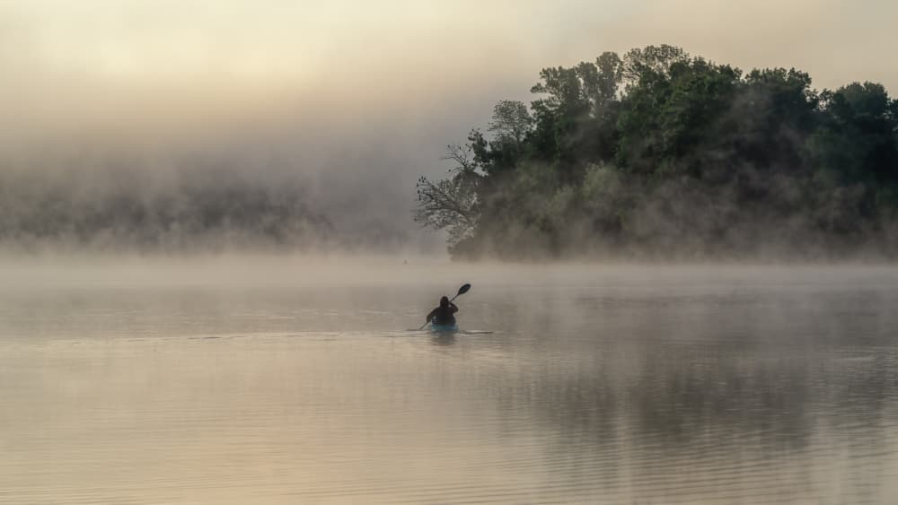 Misty Lake Kayaker by Yu Mao — canvas wall art
