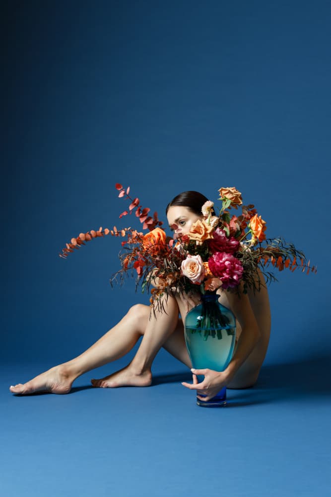 Woman Embracing Blooms by Amalya Shandelman — canvas wall art