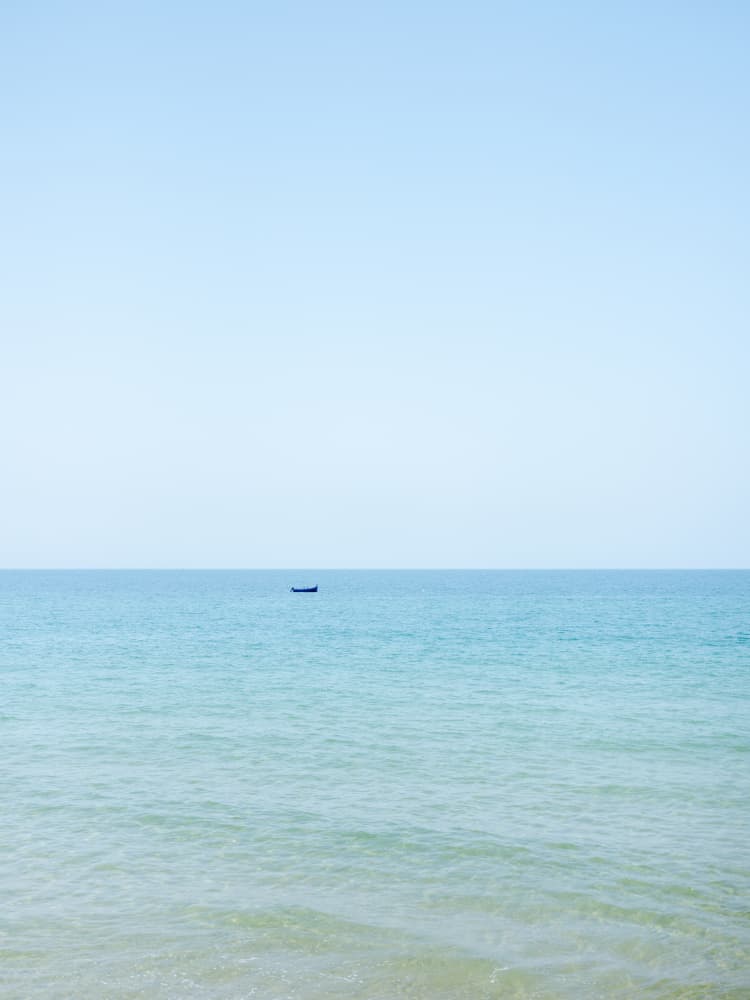 Tiny Blue Boat by Raisa Zwart — canvas wall art