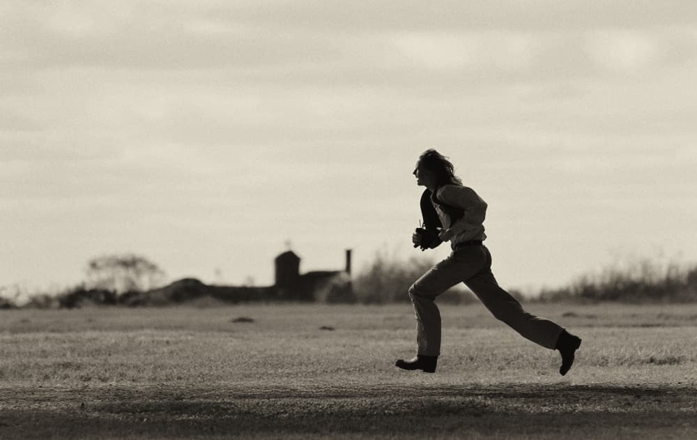 Running Man Silhouette by Michael Burlak — canvas wall art